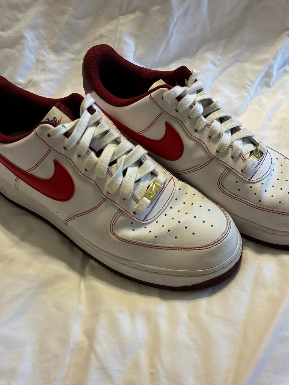 Nike Men’s White Sneakers with Red Swoosh and Maroon Lining